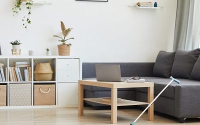 Image of modern domestic living room with laptop on the table and big sofa