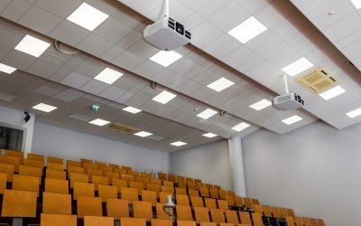 Empty university classroom with media equipment: projector, camera, audio system. For distance learning.